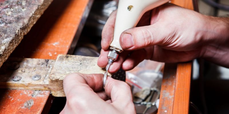 Sample of jewelry being engraved for American Awards of Augusta Maine website.